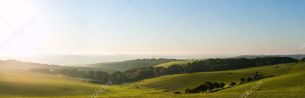 Summer sunrise over English countryside rural landscape