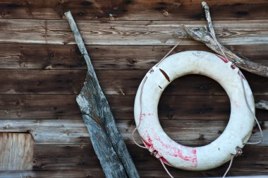 Nautical themed objects on wooden background clipart