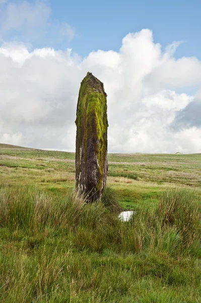 Prehistoric anicent stone in landscape against blue sky
