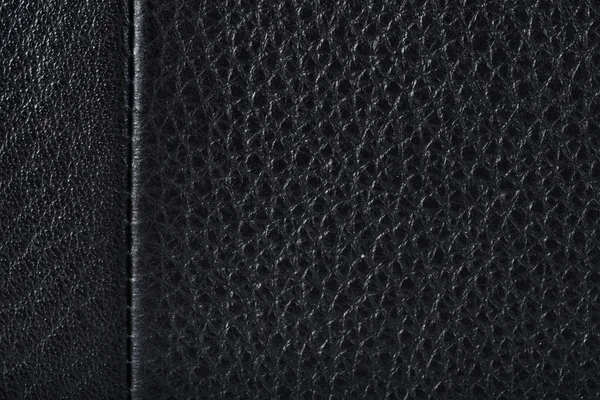 Schwarzes Leder oder Hautstruktur mit rauer Naht — Stockfoto