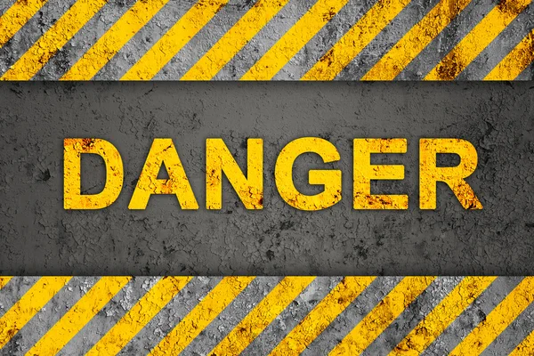 Grunge preto e laranja padrão com texto de perigo — Fotografia de Stock