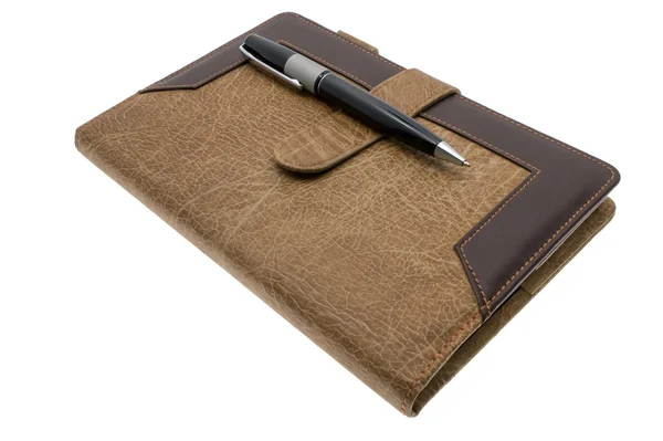 Brown notebook and pen Stock Photo