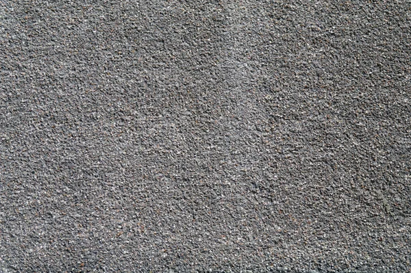 Wall covered with large granite sand. — Stock Photo, Image