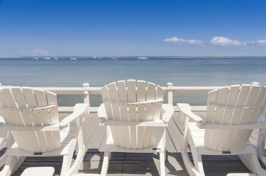 Beach chairs overlooking ocean clipart