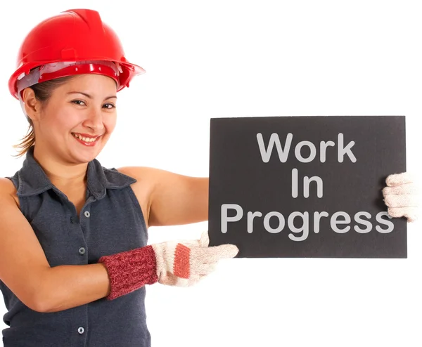 Probíhající práce znamení držení stavební dělník — Stock fotografie