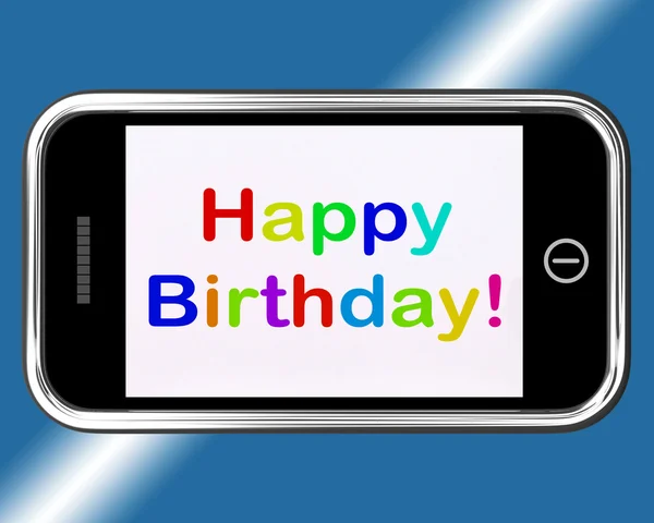 生日快乐标志的移动电话上显示了互联网的问候语 — 图库照片