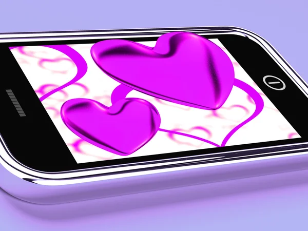 Purpurowe serca na telefon komórkowy Pokaż miłość i romans — Zdjęcie stockowe
