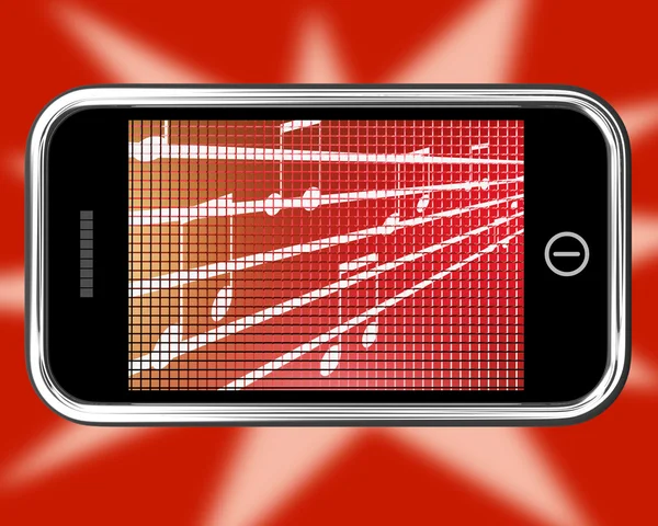 Símbolos de música no celular mostra rádio online — Fotografia de Stock