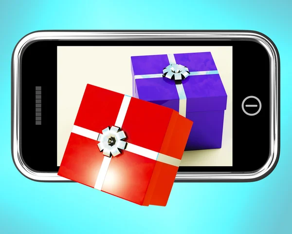 Cajas de regalo procedentes de teléfonos móviles muestra la compra de regalos en línea —  Fotos de Stock