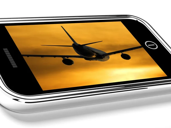 Avión volando hacia la puesta del sol en el teléfono móvil —  Fotos de Stock