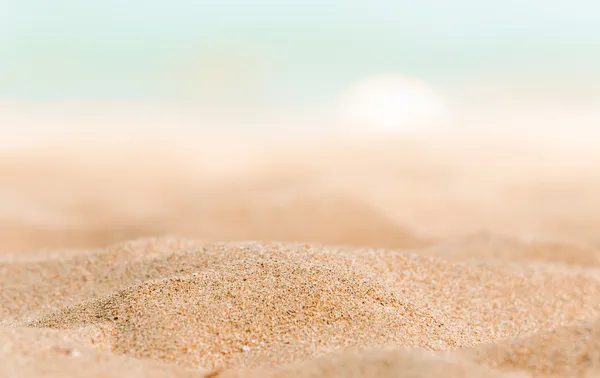 Närbild av vissa sanden på stranden Stockbild