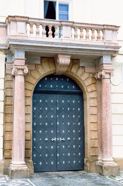 stock image Traditional medieval door with columns and balcony