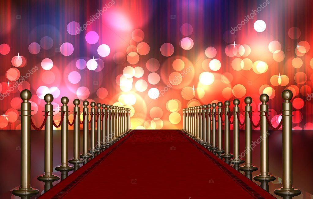 Red carpet entrance with the stanchions and the ropes. Multi Colored Light Burst over curtain