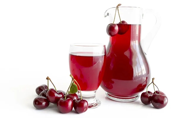 Cherry juice in glass and carafe — Stock Photo, Image