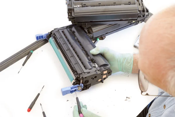 Adult man working toner cartridge — Stock Photo, Image