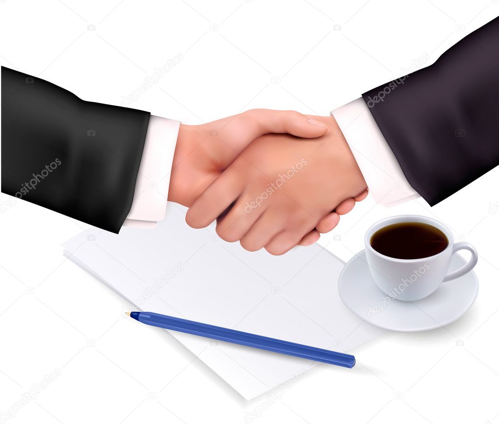 Handshake over paper and pen.