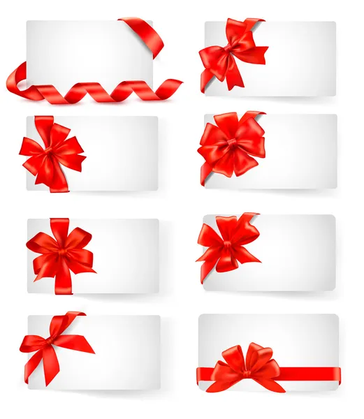Grand ensemble de cartes avec des noeuds cadeaux rouges avec des rubans vectoriel — Image vectorielle