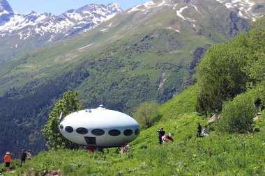 around UFO the landing between caucasus mountains clipart