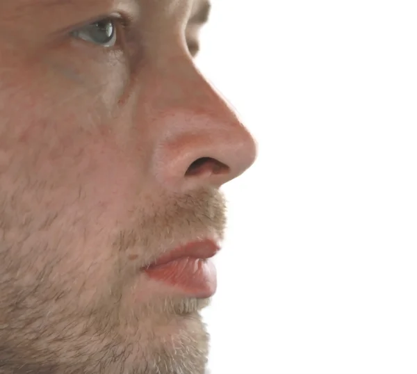 stock image White blue-eyed man looking aside on the white background isolat