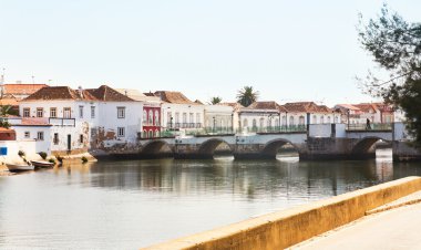 Antique bridge in Tavira, Portugal clipart