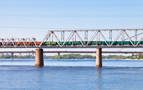 Railroad bridge through river — Stock Photo, Image