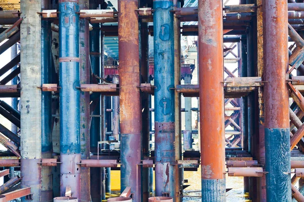 Metal rust pipes in old bridge — Stock Photo, Image