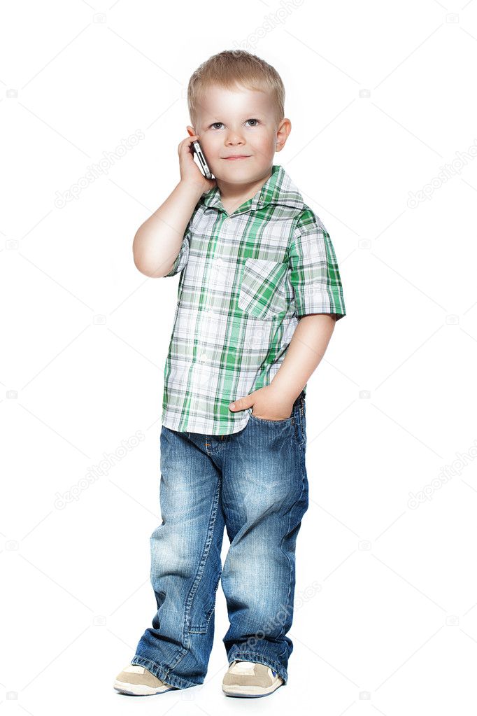 A little boy talking on the phone. isolated on white
