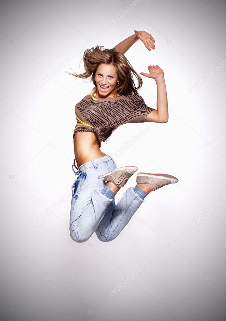 Attractive young woman dancing, hair flying