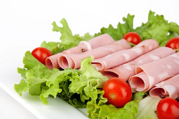 Sliced Meat with tomatoes and salad — Stock Photo, Image