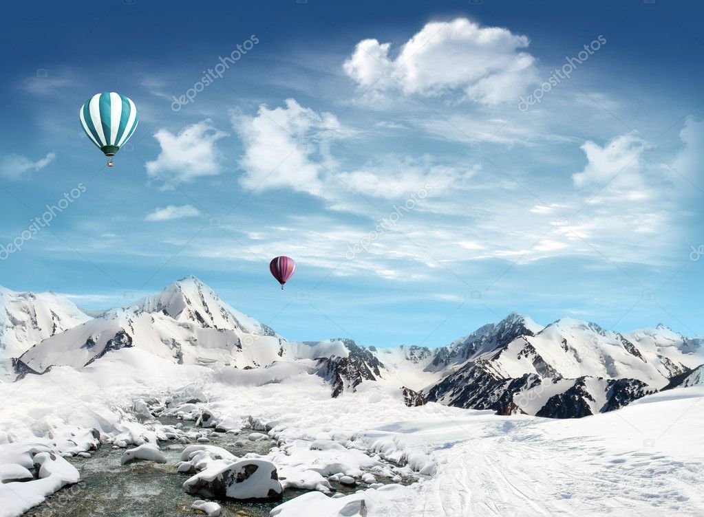 Mountain landscape with snow and stream and hot air balloon flyi