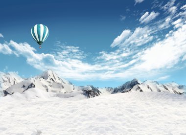 Mountain landscape with snow and hot air balloon flying in the s clipart