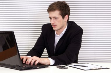 Worker with laptop clipart