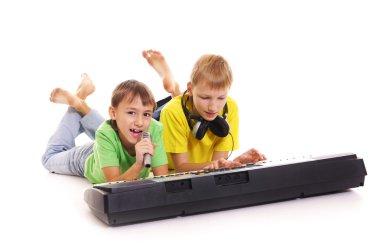 Two boys with synthesizer clipart