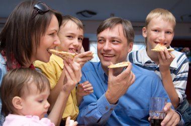 Family eating pizza clipart