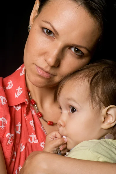 Mom and baby on a black — Stock Photo, Image