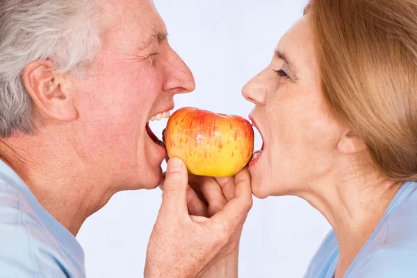 stock image Old couple with apple