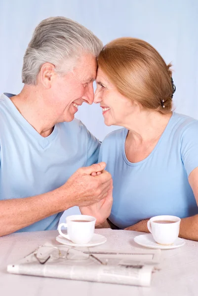 Senior couple at table — Stock Photo, Image