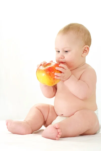 Baby with apple — Stok fotoğraf
