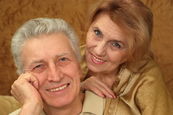 Beautiful Caucasian luck couple of aged sitting — Stock Photo, Image