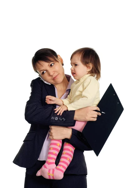 Beautiful Caucasian business woman holding her daughter in her a — Stock Photo, Image