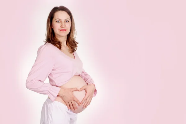Boldog terhes nő állandó — Stock Fotó