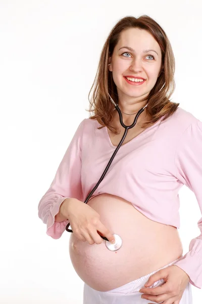 Una mujer embarazada feliz con — Foto de Stock