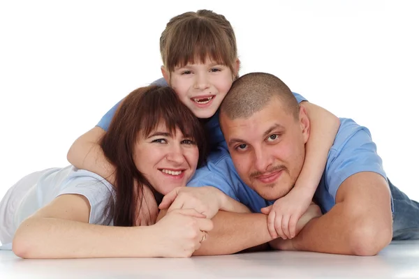 A girl lies on top of his parents — Stock Photo, Image