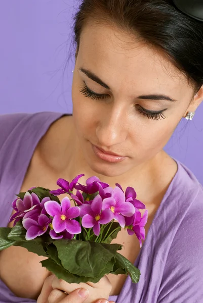 Beautiful happy Brunette Caucasian with flowers — Stock Photo, Image