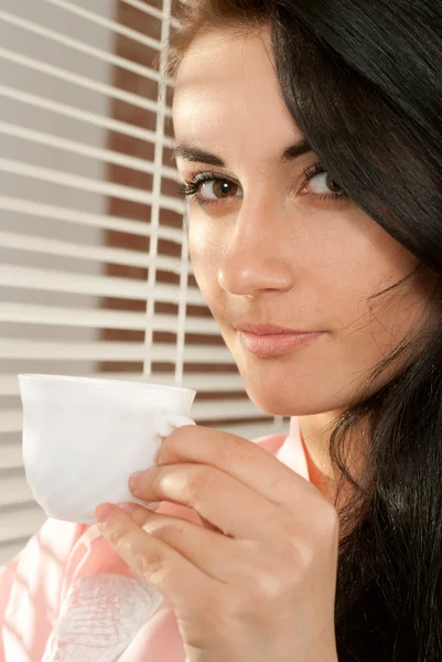 Beautiful nice woman Caucasian standing with a cup — Stock Photo, Image