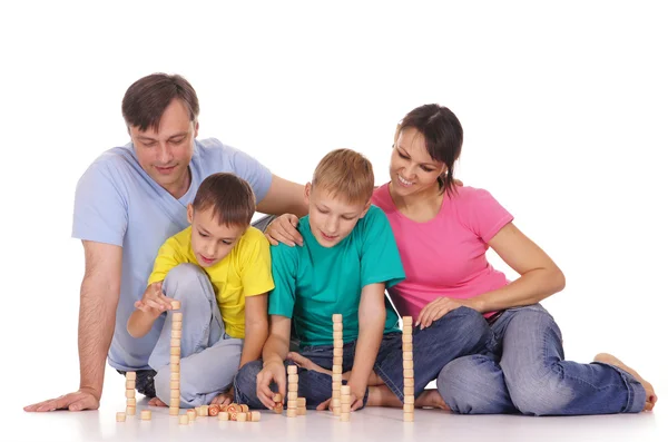 Familj spelar på golvet — Stockfoto