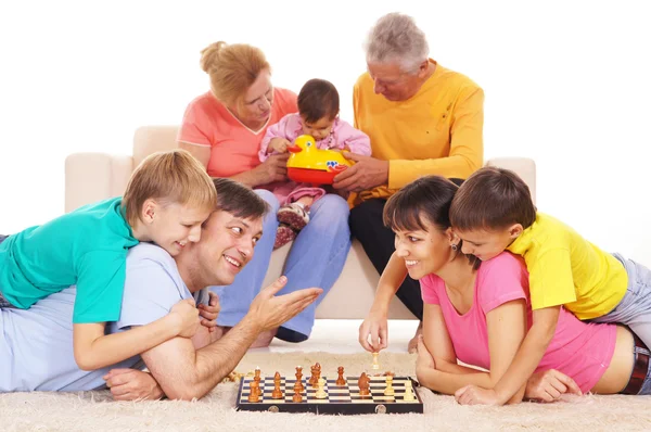 Family playing chess — Stock Photo, Image