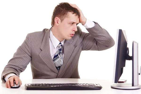 Tired business man sitting at a laptop — Stock Photo, Image