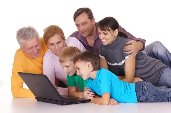 Big family with laptop — Stock Photo, Image