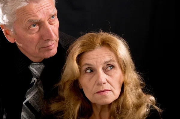 Aged couple on black — Stock Photo, Image